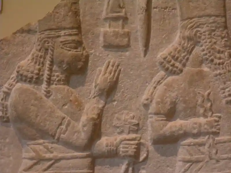 Eight-pointed cross on top of the left hand of a man, engraved on a stele